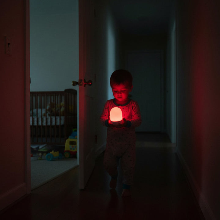 Small Child Walking In Hall With Revive GO Lamp