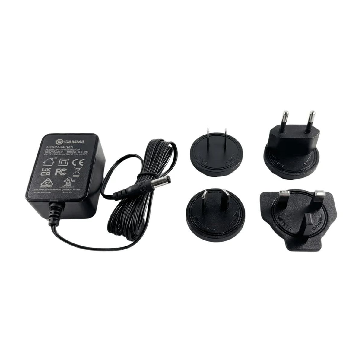 Gamma International Power Adapter with North America, Europe, Australia and China, and UK plug attachments on a white background