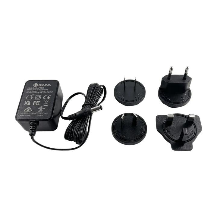 Gamma International Power Adapter with North America, Europe, Australia and China, and UK plug attachments on a white background